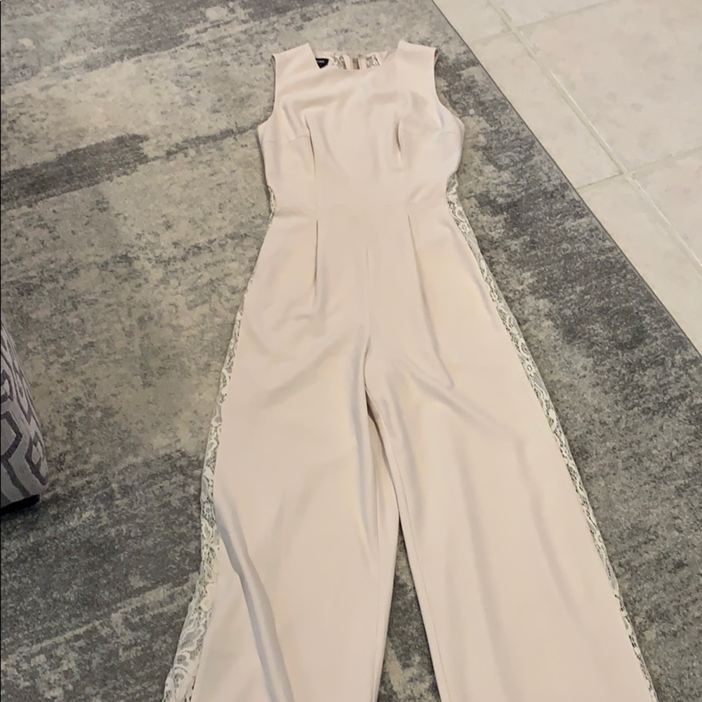 Cream romper by Bebe